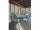 Charming outdoor dining area with lattice surround and a glass-topped table, perfect for entertaining at 6903 11Th Ave E, Palmetto, FL 34221