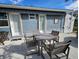 Outdoor seating on a concrete patio, with access to 2 doors at 6903 11Th Ave E, Palmetto, FL 34221