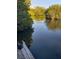 Beautiful waterfront view with calm waters surrounded by lush green trees at 6903 11Th Ave E, Palmetto, FL 34221