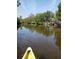 Calm waterway view with a yellow kayak and green foliage visible at 6903 11Th Ave E, Palmetto, FL 34221