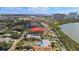 Aerial view of a waterfront neighborhood with a distant city skyline beyond the waterway at 7075 Sunset S Dr, South Pasadena, FL 33707