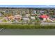 Aerial view of neighborhood and trees near the water at 7075 Sunset S Dr, South Pasadena, FL 33707