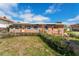 View of the front of the single story home showing front yard at 7075 Sunset S Dr, South Pasadena, FL 33707