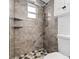 Bathroom with tiled shower, gray walls, and a small window allowing natural light at 708 53Rd N Ave, St Petersburg, FL 33703