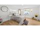 Cozy bedroom with a comfortable bed, decorative pillows, and natural light from the window at 708 53Rd N Ave, St Petersburg, FL 33703