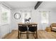 Inviting dining area with wood flooring, table for four, and neutral decor at 708 53Rd N Ave, St Petersburg, FL 33703