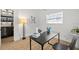 Bright office featuring modern furniture, wood floors, and a decorative table lamp at 708 53Rd N Ave, St Petersburg, FL 33703