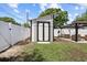 Modern shed next to outdoor gazebo, adding charm to this well maintained backyard space at 708 53Rd N Ave, St Petersburg, FL 33703