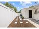 Well-maintained side yard with stepping stones, new fence and updated electrical at 708 53Rd N Ave, St Petersburg, FL 33703