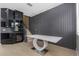 Dining area with gray accent wall and modern table at 7130 102Nd Ln, Seminole, FL 33772