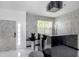 Grand foyer with marble floors, statement lighting, and stylish console table sets a sophisticated tone at 7130 102Nd Ln, Seminole, FL 33772