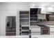 Modern kitchen featuring sleek white cabinets, stainless steel appliances, and lots of storage at 7130 102Nd Ln, Seminole, FL 33772