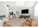 Open-concept living room and kitchen area with modern decor and hardwood floors at 7130 102Nd Ln, Seminole, FL 33772