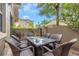 Outdoor patio featuring wicker chairs and a glass-topped table, perfect for relaxation at 7130 102Nd Ln, Seminole, FL 33772