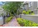 Charming walkway with brick pavers and lush landscaping, leading to community amenities at 7130 102Nd Ln, Seminole, FL 33772
