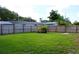 Spacious backyard with well-maintained lawn and a wooden fence around the perimeter at 731 20Th Nw St, Largo, FL 33770