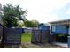 Spacious backyard with a wooden fence and grass, offers privacy and security at 731 20Th Nw St, Largo, FL 33770