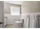 Bathroom featuring a toilet, vanity, and a window at 731 20Th Nw St, Largo, FL 33770