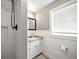 Clean bathroom featuring a stand-up shower, vanity and neutral paint at 731 20Th Nw St, Largo, FL 33770