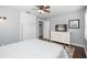 Bedroom with TV, white dresser, closet, ceiling fan, and natural light at 731 20Th Nw St, Largo, FL 33770