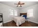 Bedroom with bed, ceiling fan, and natural light from two windows at 731 20Th Nw St, Largo, FL 33770
