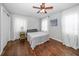 A serene bedroom with hardwood floors, natural light, and neutral tones at 731 20Th Nw St, Largo, FL 33770