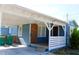 Exterior home with covered carport and stairs to the front porch at 731 20Th Nw St, Largo, FL 33770
