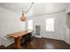 Inviting dining room featuring a rustic table, chandelier, and hardwood floors at 731 20Th Nw St, Largo, FL 33770
