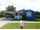 Charming home with a front yard, covered parking, and eye-catching curb appeal at 731 20Th Nw St, Largo, FL 33770