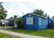 Charming home featuring a neatly landscaped lawn, carport, and a welcoming facade at 731 20Th Nw St, Largo, FL 33770