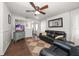 Comfortable living area with stylish furniture, a ceiling fan, and natural light at 731 20Th Nw St, Largo, FL 33770