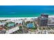 Beautiful aerial view of the condominiums, tennis courts, and pool area, near the beach at 7564 Bayshore Dr # 302, Treasure Island, FL 33706