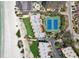 Overhead shot of condos and tennis courts on Treasure Island near beach and Gulf of Mexico at 7564 Bayshore Dr # 302, Treasure Island, FL 33706