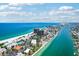 Panoramic aerial showcases condos, beach access, and a pool overlooking the Gulf in Treasure Island at 7564 Bayshore Dr # 302, Treasure Island, FL 33706