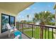 Balcony featuring breathtaking ocean views, perfect for relaxing and enjoying the sea breeze at 7564 Bayshore Dr # 302, Treasure Island, FL 33706