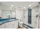 Contemporary bathroom featuring a sleek shower with modern finishes and granite countertops at 7564 Bayshore Dr # 302, Treasure Island, FL 33706