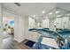 Bright bathroom featuring blue granite counters, white cabinets, and modern fixtures at 7564 Bayshore Dr # 302, Treasure Island, FL 33706