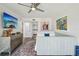 Comfortable bedroom with stylish decor, art, a daybed, and modern furnishings at 7564 Bayshore Dr # 302, Treasure Island, FL 33706