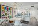Stylish dining area with modern decor, adjacent to a well-equipped kitchen with ample counter space at 7564 Bayshore Dr # 302, Treasure Island, FL 33706
