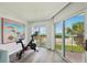 Bright exercise room with a scenic beach view, perfect for staying active and enjoying the beautiful surroundings at 7564 Bayshore Dr # 302, Treasure Island, FL 33706