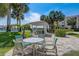 Charming gazebo with seating and tables providing a relaxing outdoor space at 7564 Bayshore Dr # 302, Treasure Island, FL 33706