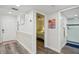 Hallway view showing bedroom entrance and bathroom with glass shower at 7564 Bayshore Dr # 302, Treasure Island, FL 33706