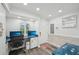 Functional home office featuring built-in desks, natural light, and ample storage for an efficient workspace at 7564 Bayshore Dr # 302, Treasure Island, FL 33706