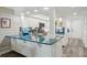 Bright and modern kitchen with stylish countertops, stainless steel appliances, and plenty of cabinet storage at 7564 Bayshore Dr # 302, Treasure Island, FL 33706