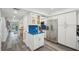 Modern kitchen with stainless steel appliances, ample cabinet space, and stylish blue accents at 7564 Bayshore Dr # 302, Treasure Island, FL 33706