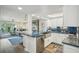 Updated kitchen featuring stainless steel appliances, a farmhouse sink and bright blue counter tops at 7564 Bayshore Dr # 302, Treasure Island, FL 33706