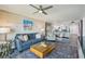 Cozy living room with neutral tones and decor with an open view of the kitchen at 7564 Bayshore Dr # 302, Treasure Island, FL 33706
