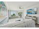 Relaxing main bedroom with ocean views, a plush bed, and contemporary furniture for ultimate comfort at 7564 Bayshore Dr # 302, Treasure Island, FL 33706