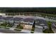Stunning aerial view of homes near a serene lake, surrounded by lush green trees at 7819 Notched Pine Bnd, Wesley Chapel, FL 33545