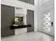 Elegant foyer with decorative wall accents, high ceilings, and contemporary design at 7819 Notched Pine Bnd, Wesley Chapel, FL 33545